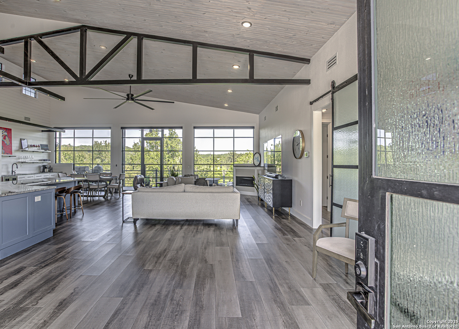 2705 Campestres Spring Branch, TX 78070 - Photo 19 of 35 a living room with stainless steel appliances furniture wooden floor and a large window