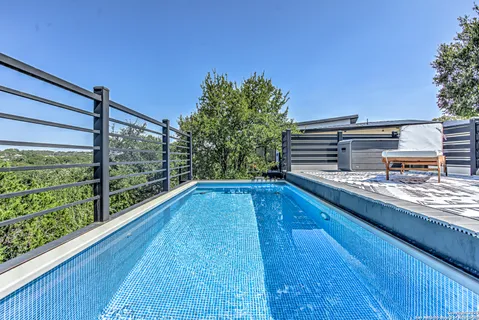a view of a swimming pool with a patio