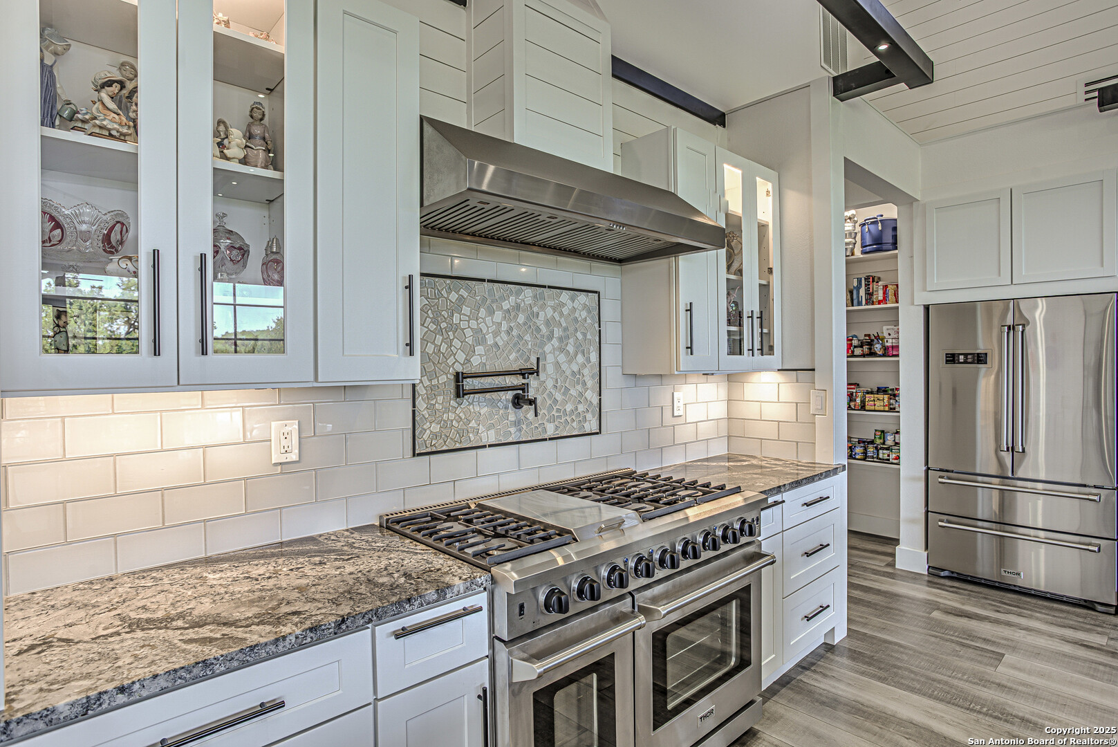2705 Campestres Spring Branch, TX 78070 - Photo 29 of 35 a kitchen with stainless steel appliances granite countertop a stove and a refrigerator