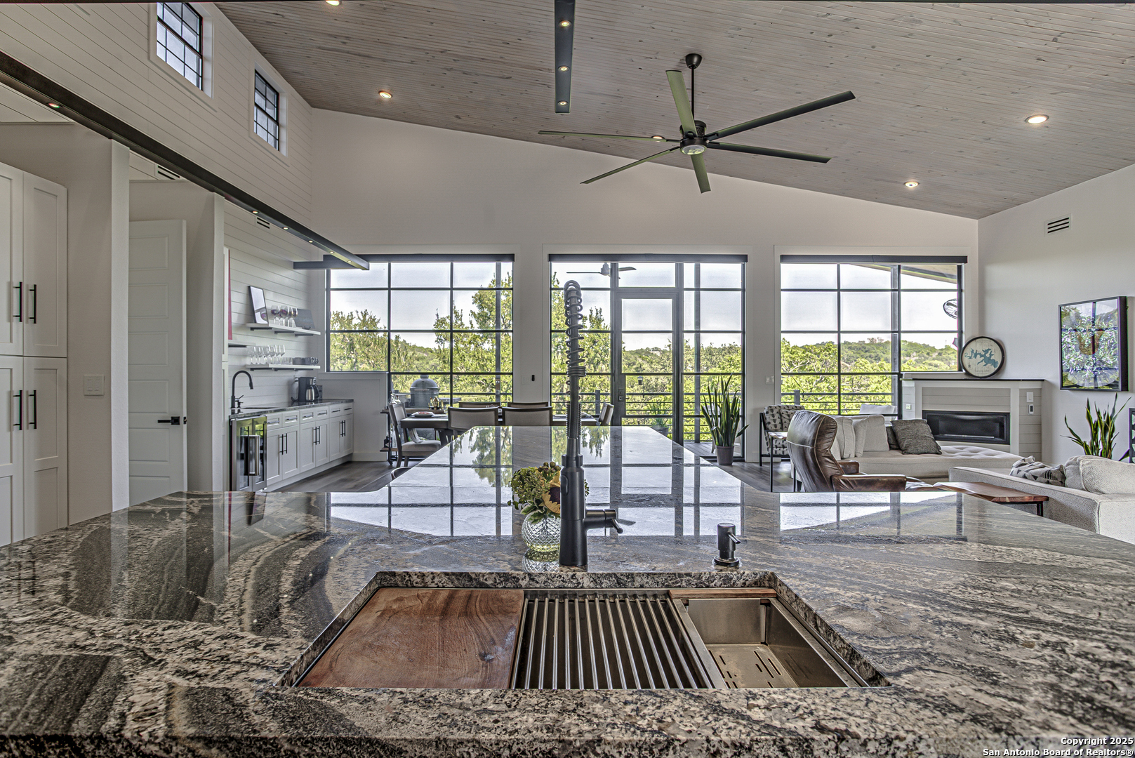 2705 Campestres Spring Branch, TX 78070 - Photo 30 of 35 a living room with furniture and a floor to ceiling window