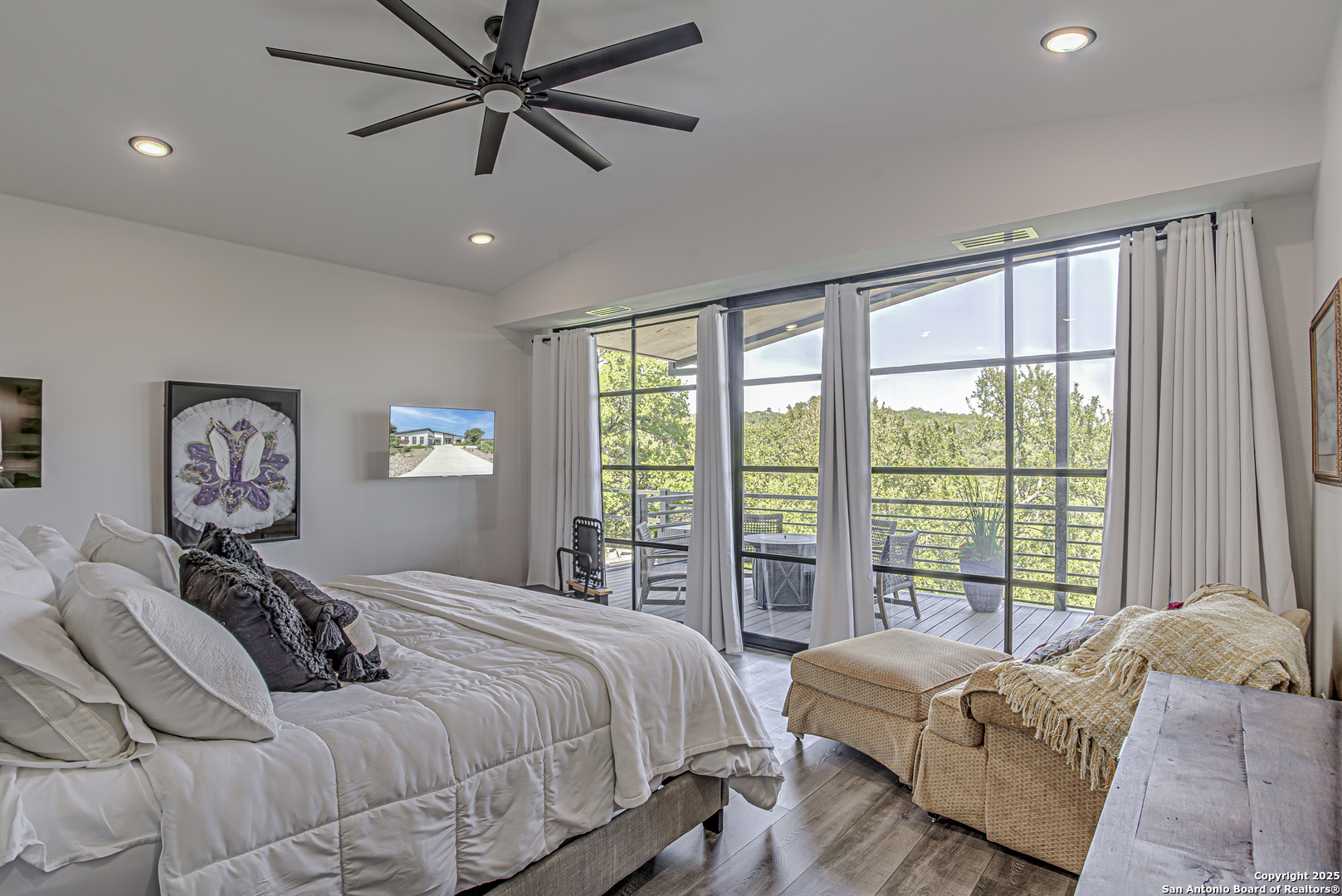 2705 Campestres Spring Branch, TX 78070 - Photo 3 of 35 a bedroom with a large bed and a large window