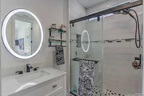a bathroom with a sink and a mirror