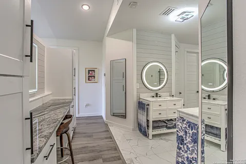 a view of a hallway with seating space