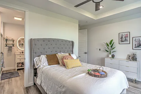 a bedroom with a bed and a table