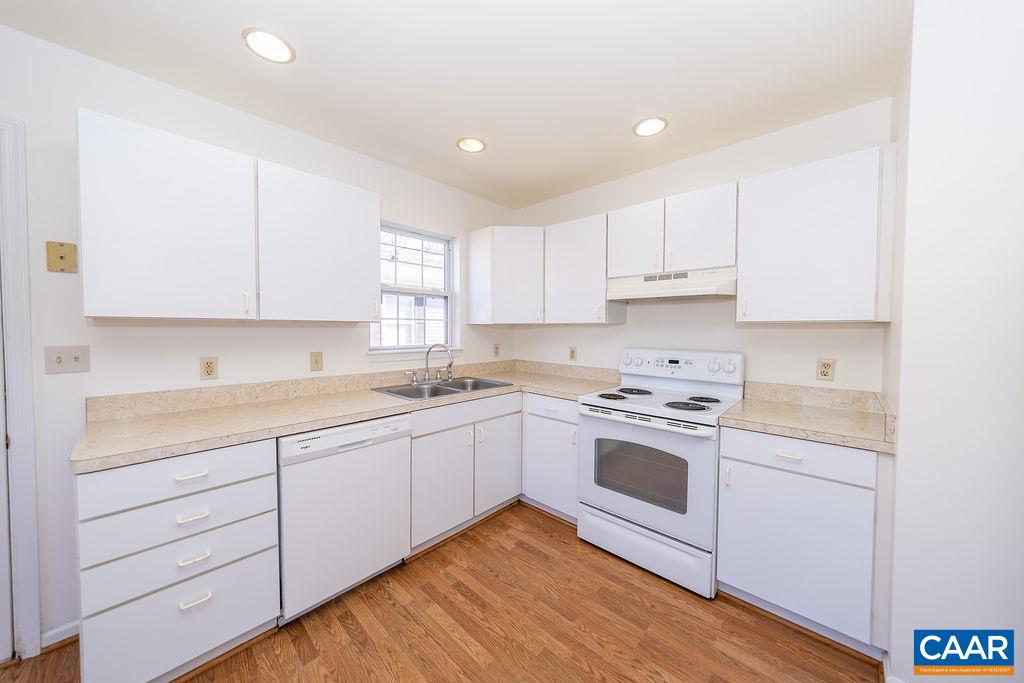 65 Pendleton Way Stanardsville, VA 22973 - Photo 5 of 33 a kitchen with granite countertop white cabinets and white appliances