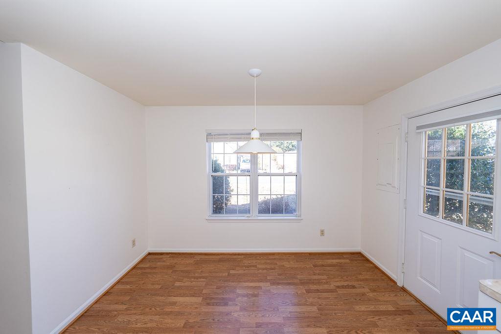 65 Pendleton Way Stanardsville, VA 22973 - Photo 8 of 33 an empty room with wooden floor and windows