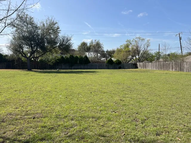 a view of a field with an ocean