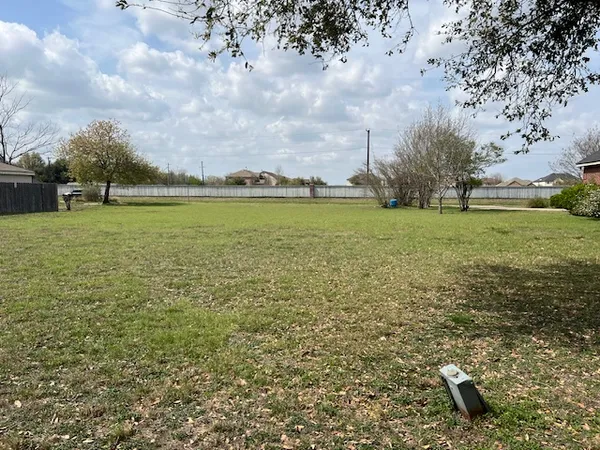 a view of a backyard of the house