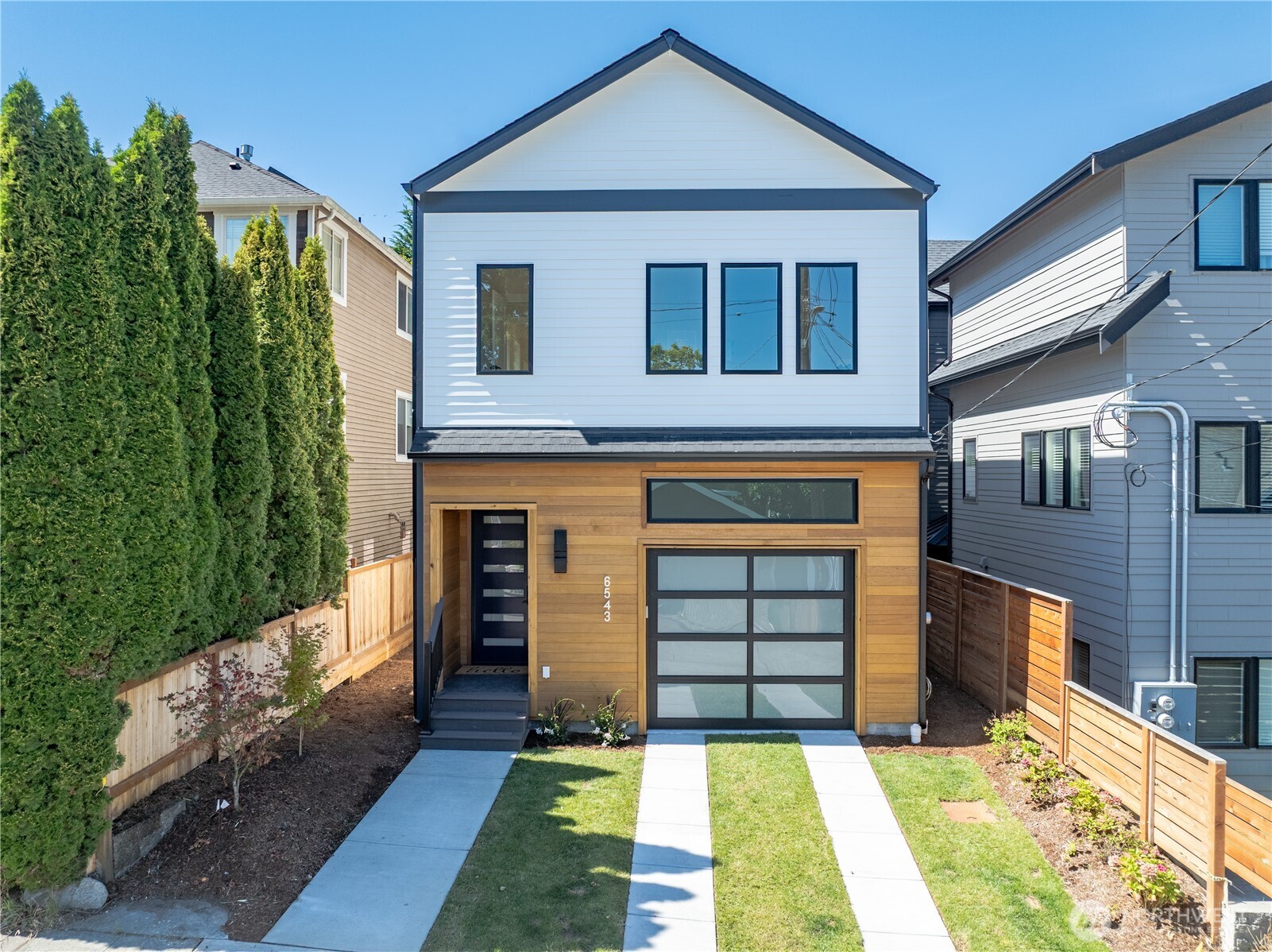 6543 Chapin Place North Seattle, WA 98103 - Photo 1 of 40 a front view of a house with a yard