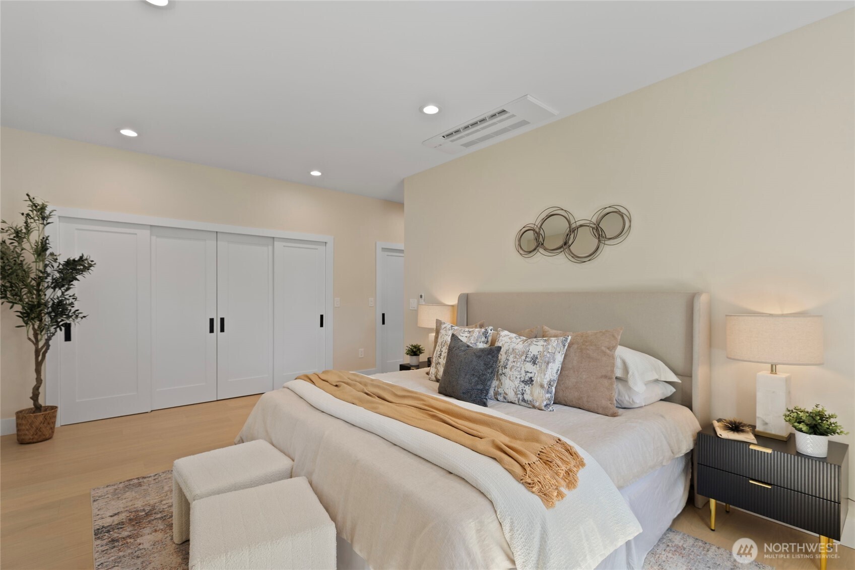6543 Chapin Place North Seattle, WA 98103 - Photo 12 of 40 a bedroom with a bed and a potted plant