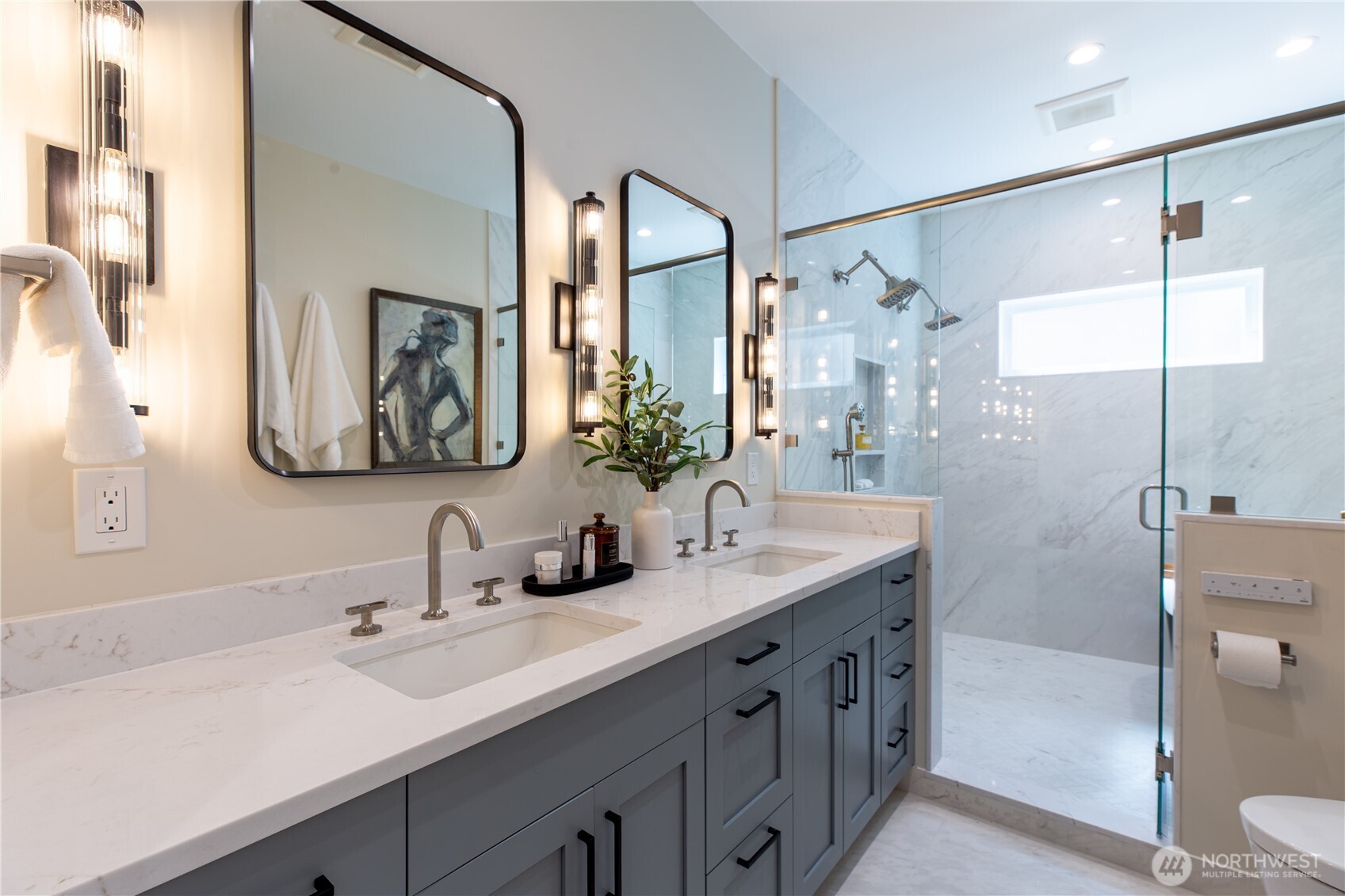 6543 Chapin Place North Seattle, WA 98103 - Photo 14 of 40 a bathroom with a double vanity sink mirror and double