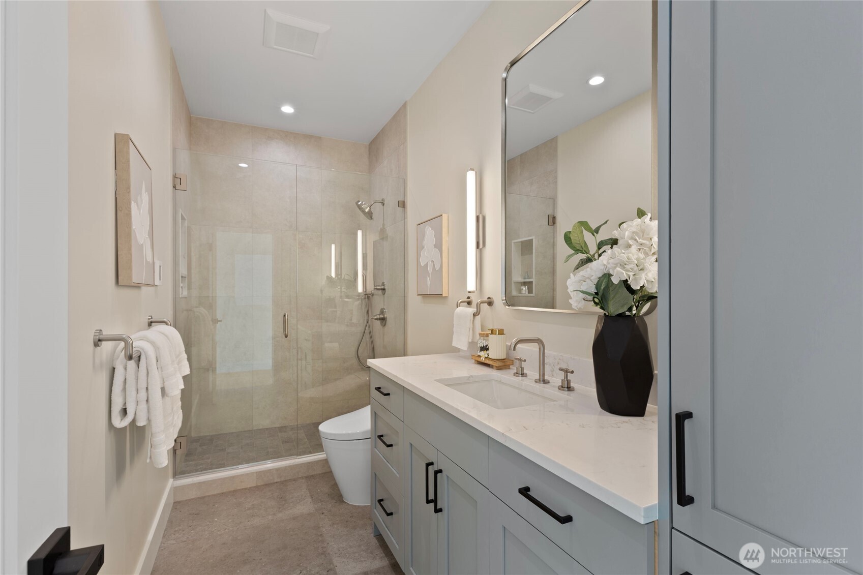 6543 Chapin Place North Seattle, WA 98103 - Photo 22 of 40 a bathroom with a sink a toilet and shower