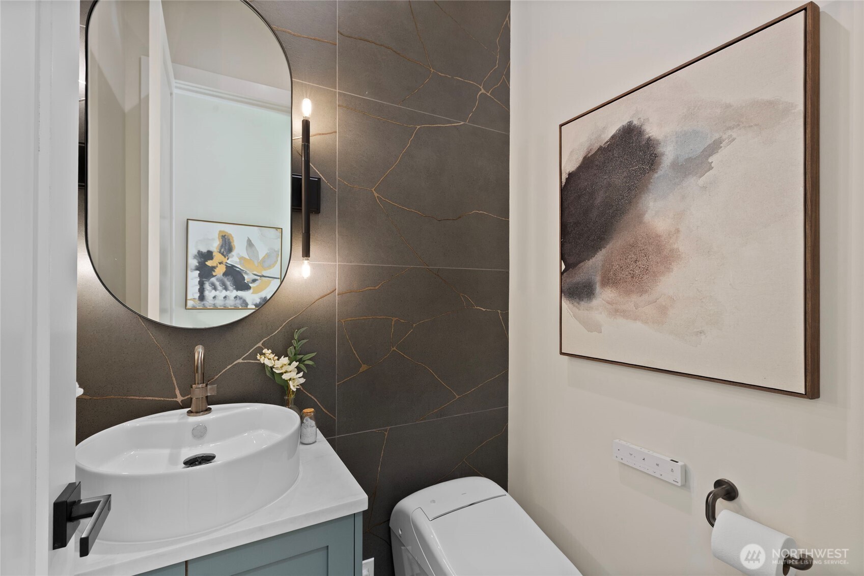 6543 Chapin Place North Seattle, WA 98103 - Photo 27 of 40 a bathroom with a sink mirror and toilet