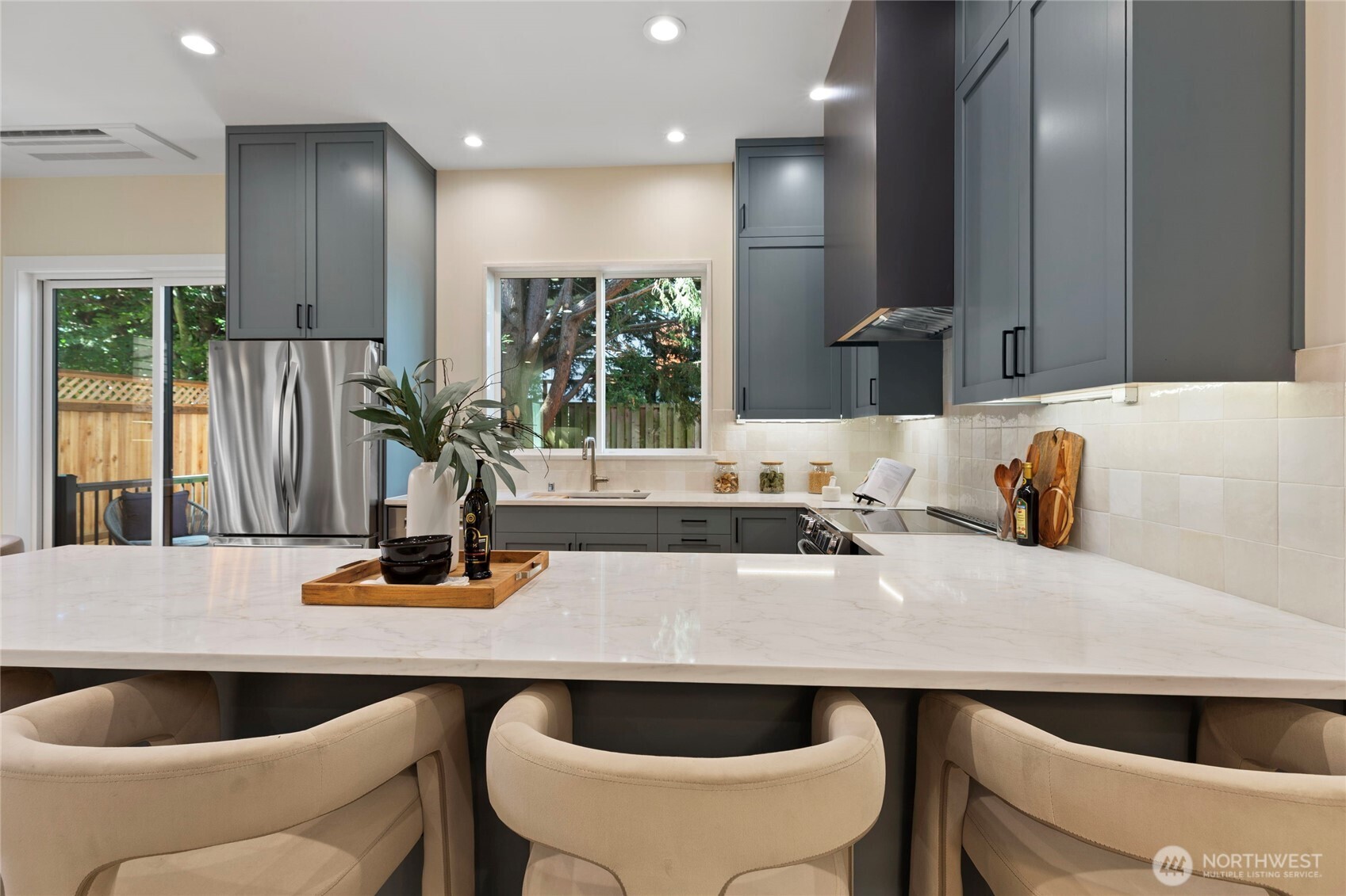 6543 Chapin Place North Seattle, WA 98103 - Photo 8 of 40 a kitchen with a table chairs sink and cabinets
