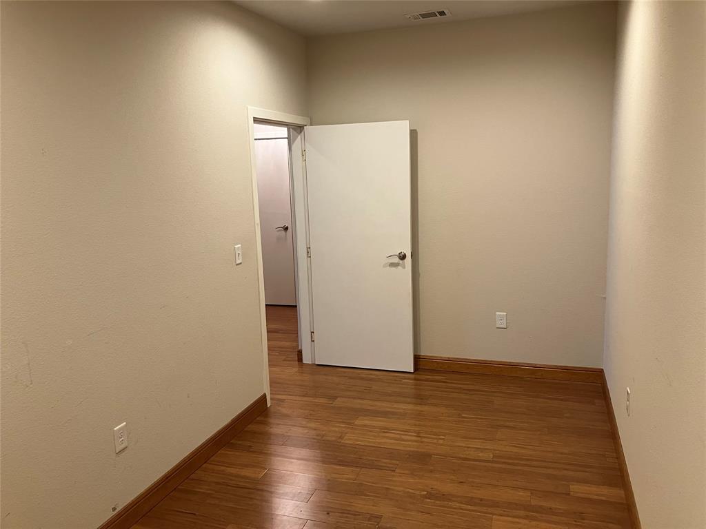 1220 West Trinity Mills Road, Unit 5009 Carrollton, TX 75006 - Photo 13 of 25 a view of an empty room