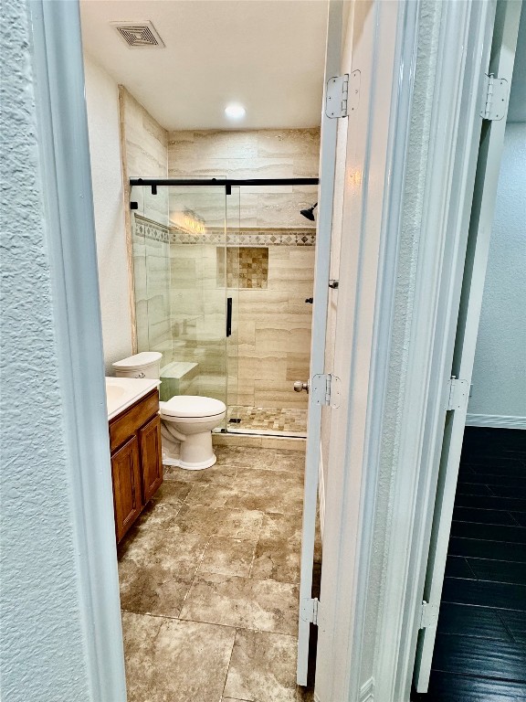 21424 Quail Point Lane Porter, TX 77365 - Photo 19 of 49 a bathroom with a granite countertop sink toilet and shower
