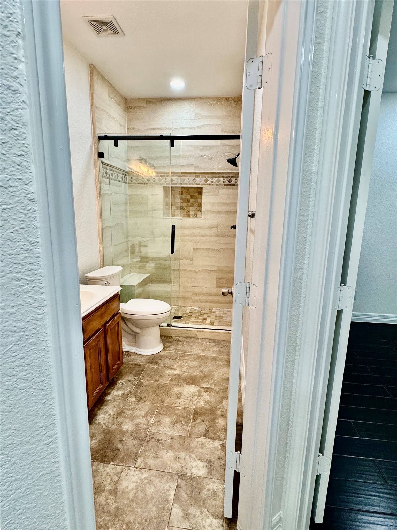 21424 Quail Point Lane Porter, TX 77365 - Photo 19 of 49 a bathroom with a granite countertop sink toilet and shower
