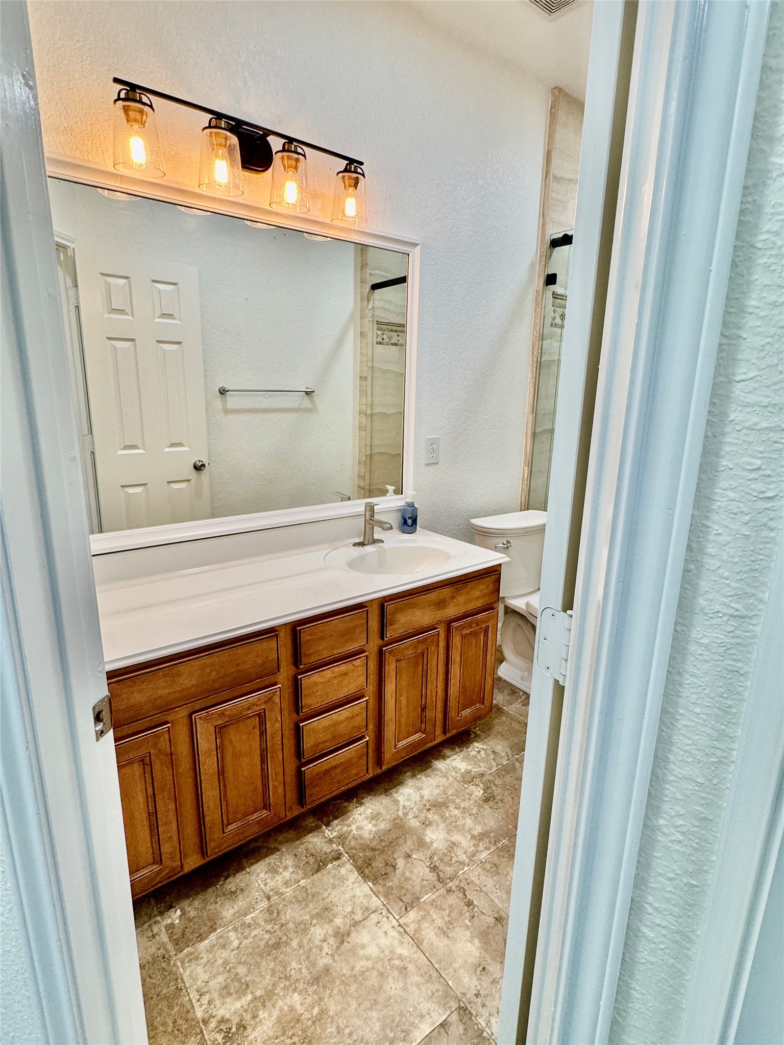 21424 Quail Point Lane Porter, TX 77365 - Photo 20 of 49 a bathroom with a sink and a mirror