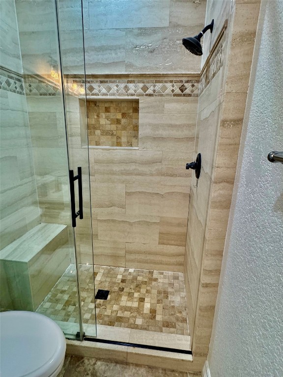 21424 Quail Point Lane Porter, TX 77365 - Photo 22 of 49 a bathroom with a shower and toilet