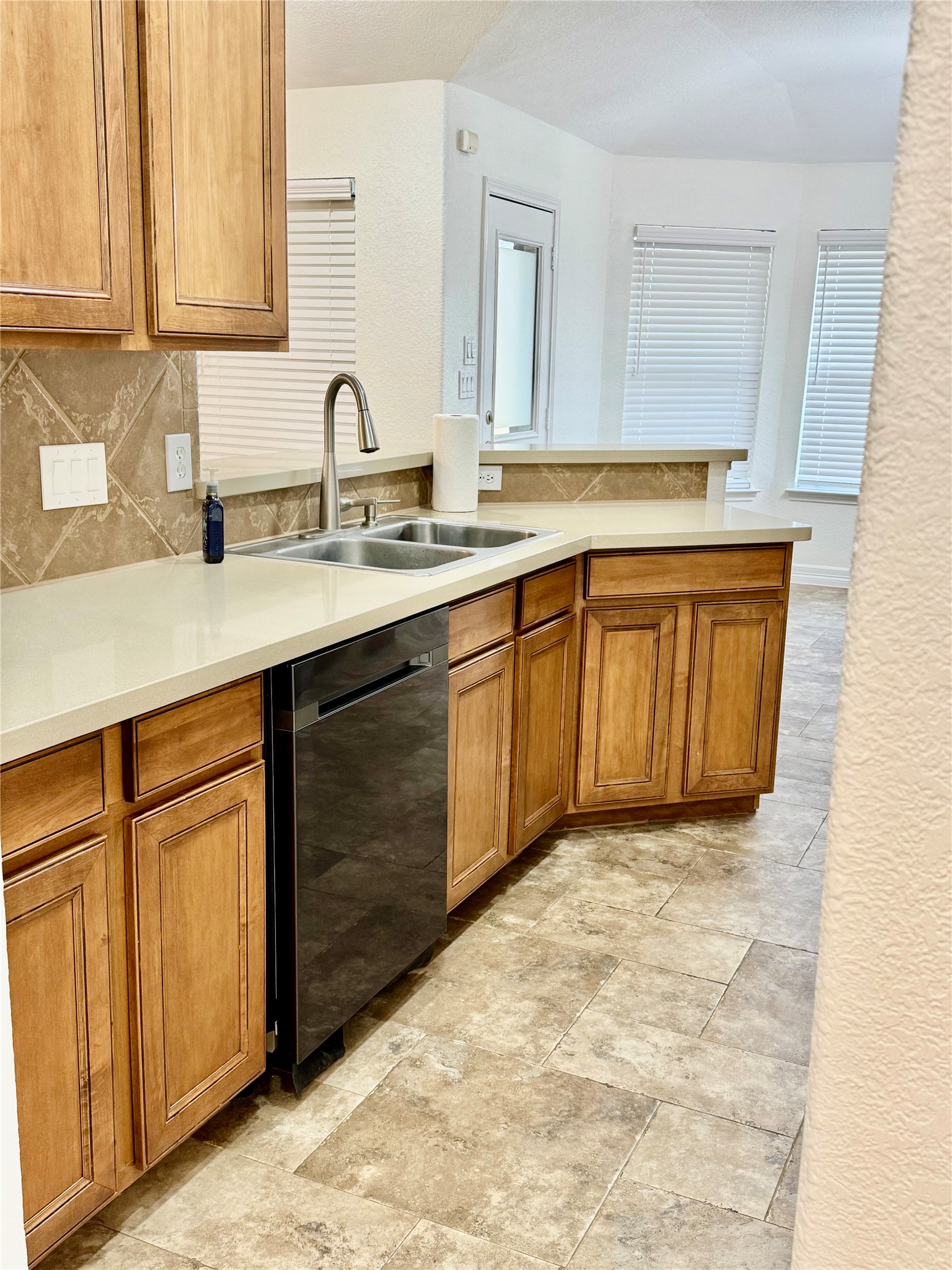 21424 Quail Point Lane Porter, TX 77365 - Photo 38 of 49 a kitchen with granite countertop a sink stainless steel appliances and cabinets