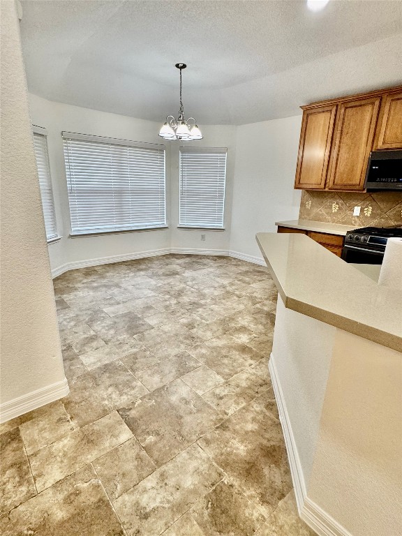 21424 Quail Point Lane Porter, TX 77365 - Photo 40 of 49 a view of a kitchen with granite countertop cabinets and a appliances