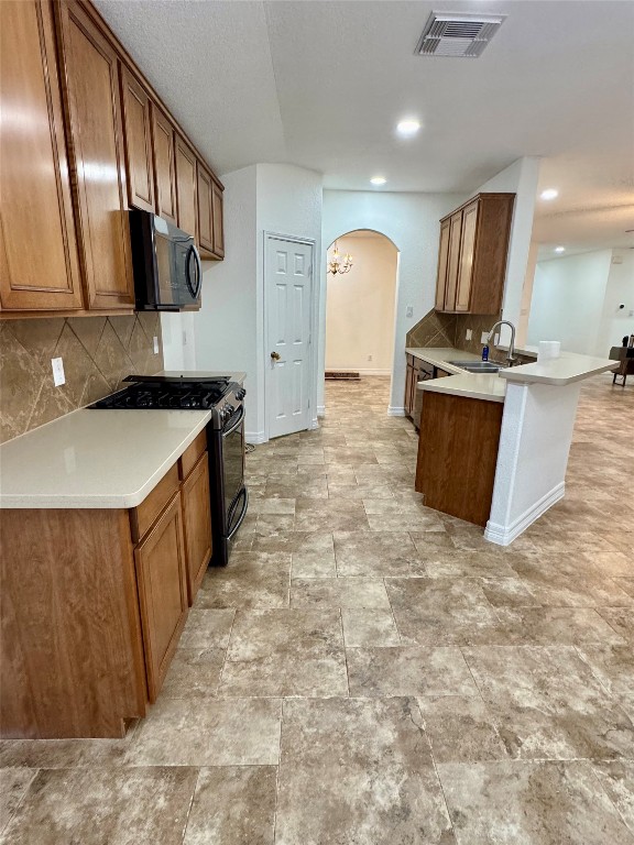 21424 Quail Point Lane Porter, TX 77365 - Photo 41 of 49 a kitchen with stainless steel appliances granite countertop a sink stove and cabinets