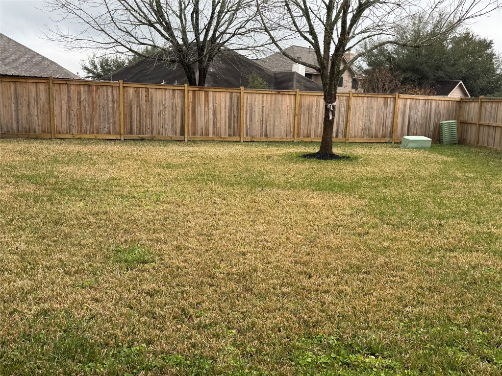 21424 Quail Point Lane Porter, TX 77365 - Photo 49 of 49 a view of a yard with wooden fence