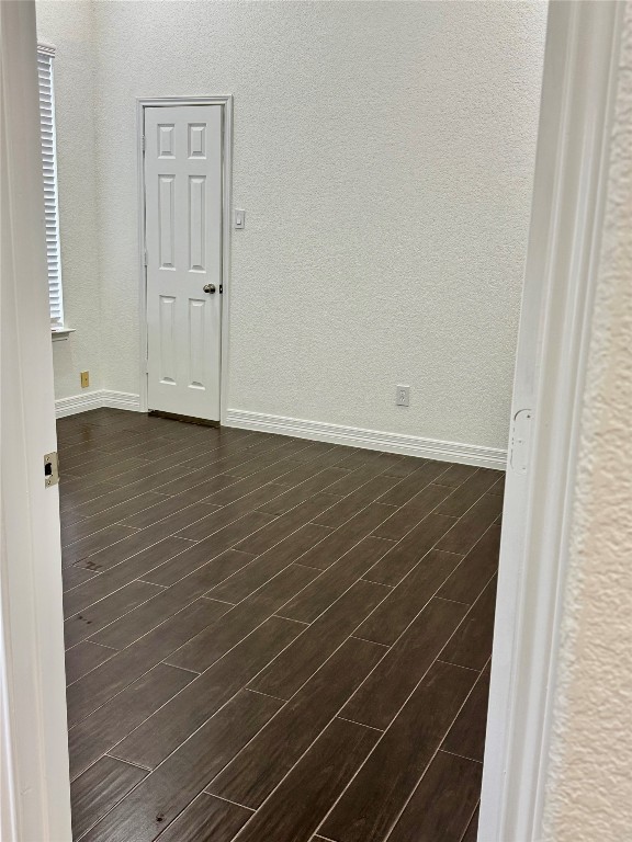 21424 Quail Point Lane Porter, TX 77365 - Photo 8 of 49 a view of an empty room with wooden floor and entryway