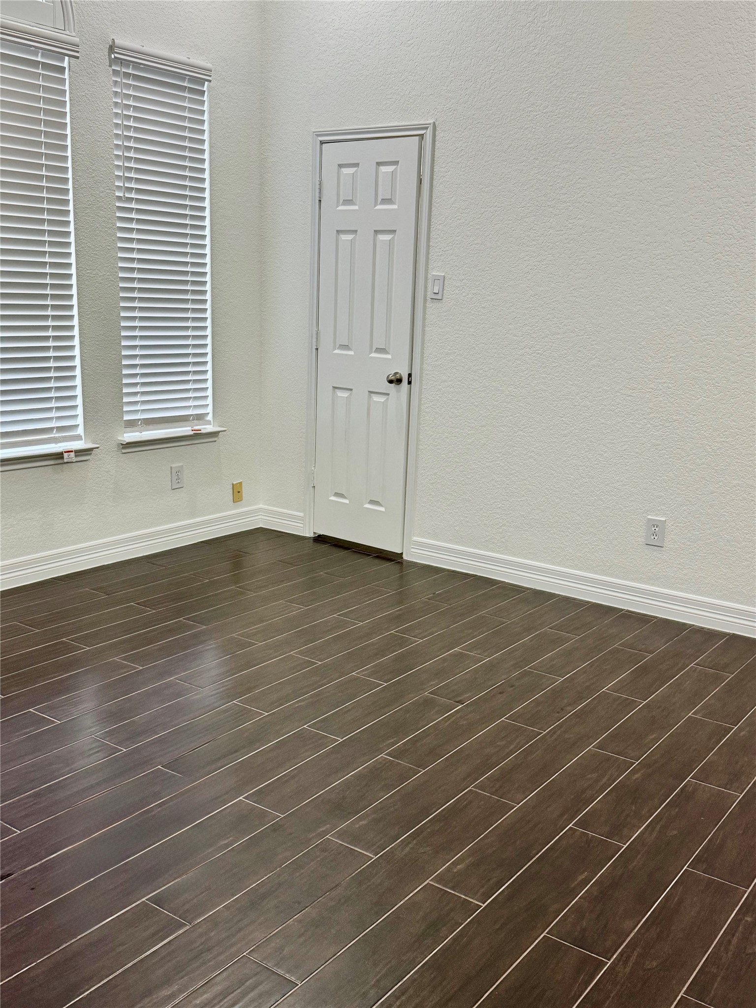 21424 Quail Point Lane Porter, TX 77365 - Photo 9 of 49 an empty room with wooden floor and windows