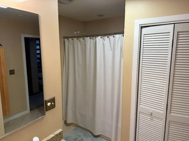 a view of a bathroom with a shower curtain