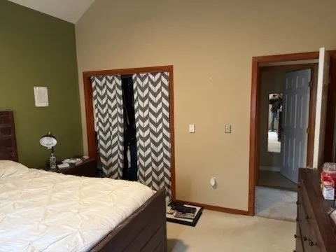 a bedroom with a bed and a table