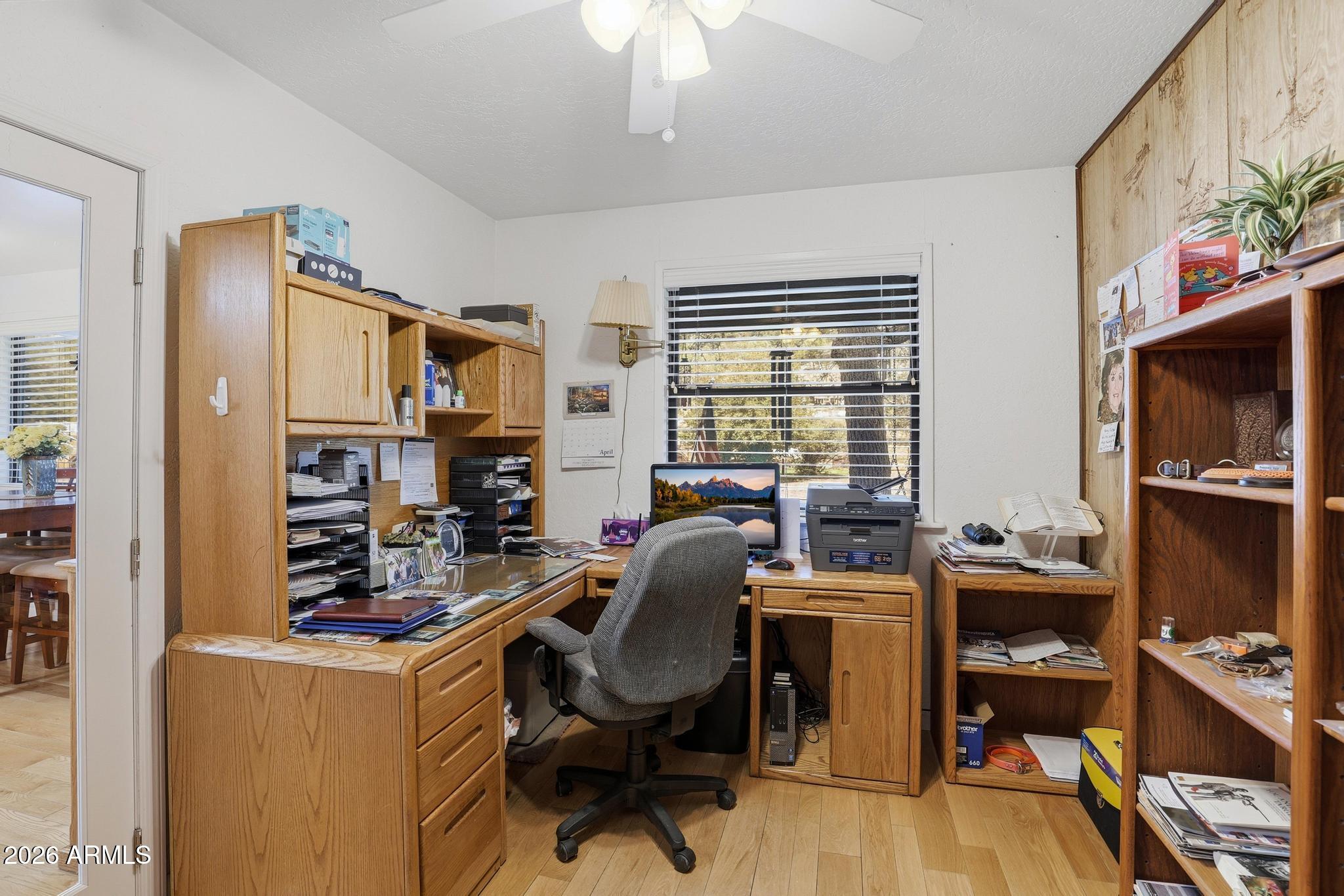 7736 West Gibson Ranch Road Payson, AZ 85541 - Photo 26 of 51 a view of a workspace with furniture and a window
