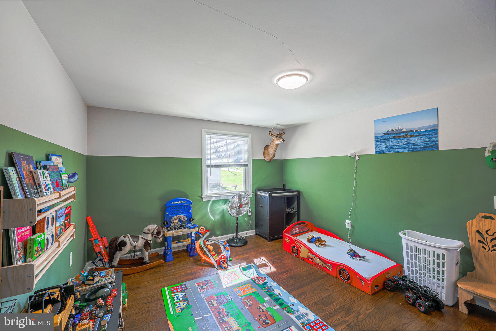 5571 Blooming Grove Road Glenville, PA 17329 - Photo 11 of 29 a room with toys and a wooden floor