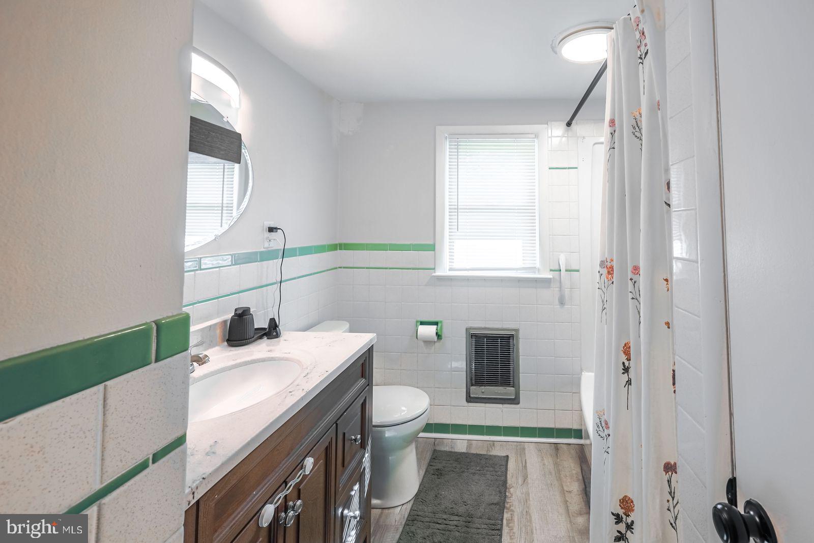 5571 Blooming Grove Road Glenville, PA 17329 - Photo 15 of 29 a bathroom with a sink a toilet and a mirror