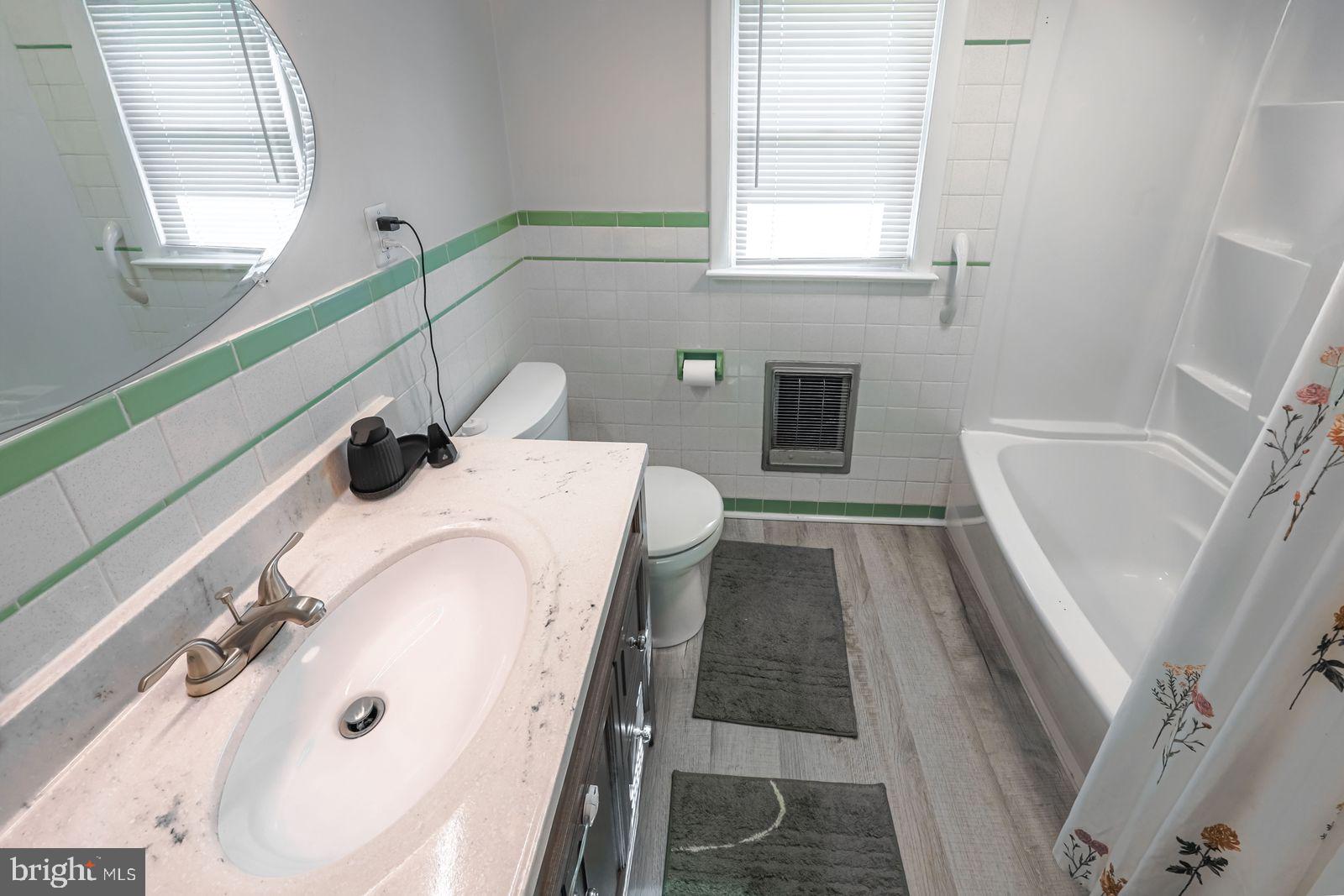 5571 Blooming Grove Road Glenville, PA 17329 - Photo 16 of 29 a bathroom with a tub sink and mirror
