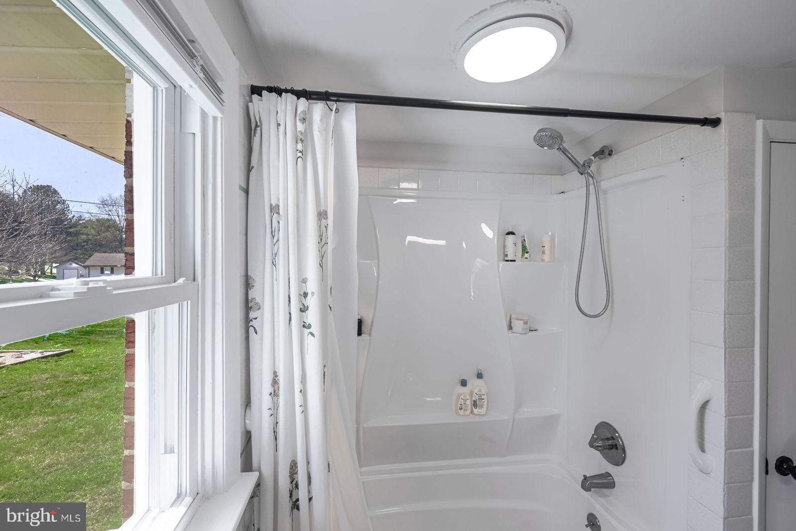 5571 Blooming Grove Road Glenville, PA 17329 - Photo 17 of 29 a bathroom with a shower and a window