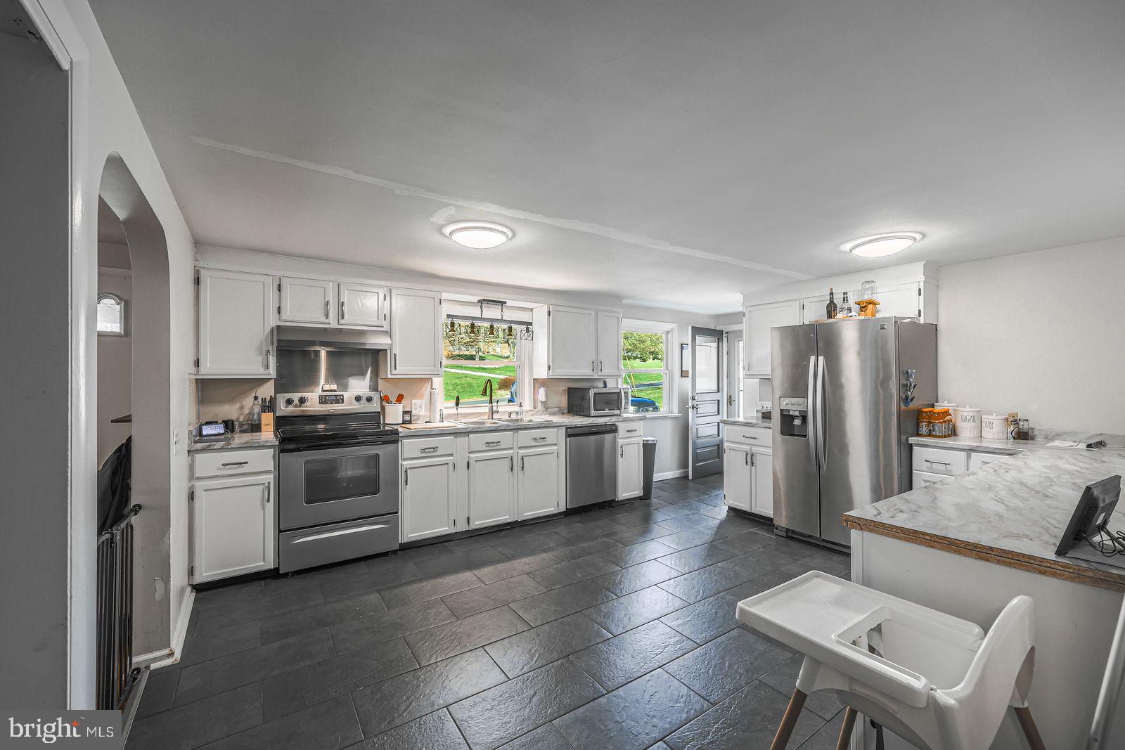 5571 Blooming Grove Road Glenville, PA 17329 - Photo 5 of 29 a kitchen with a sink cabinets and stainless steel appliances