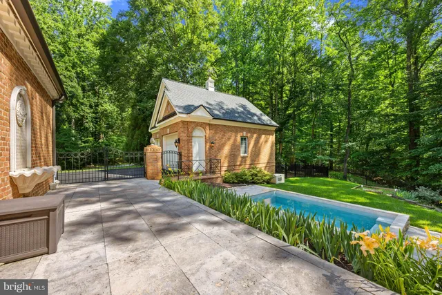 a view of a backyard with swimming pool