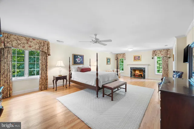 a bathroom with a tub sink shower and mirror