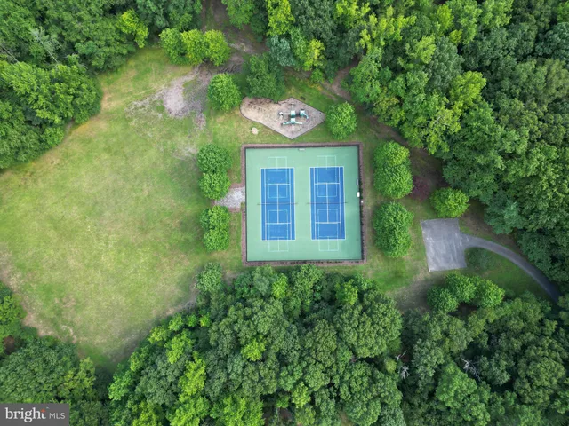 a view of a backyard with sitting area