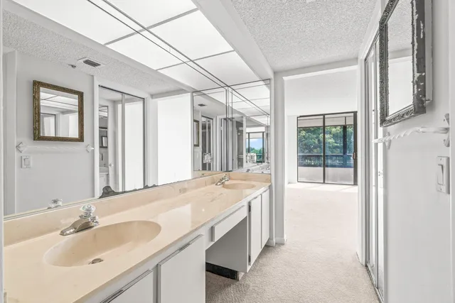 a view of a balcony with wooden floor and iron stairs