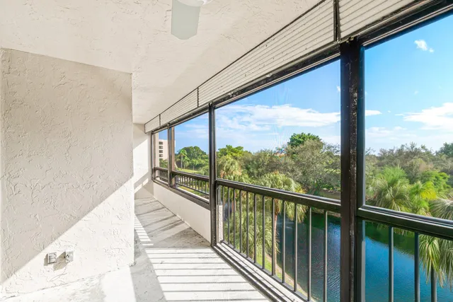 a view of a lake with a house in the background