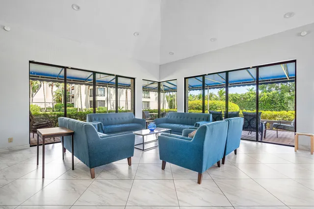 a view of a living room and a balcony