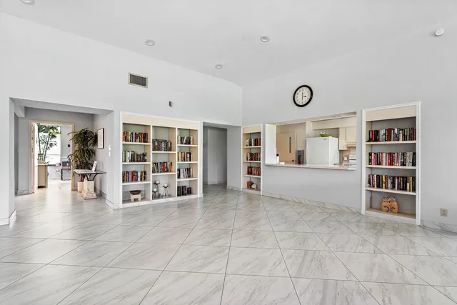 a kitchen with stainless steel appliances a refrigerator sink and cabinets