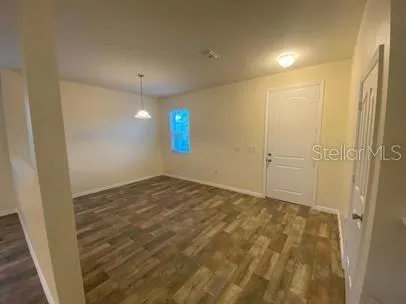 a large kitchen with stainless steel appliances granite countertop a sink and stove