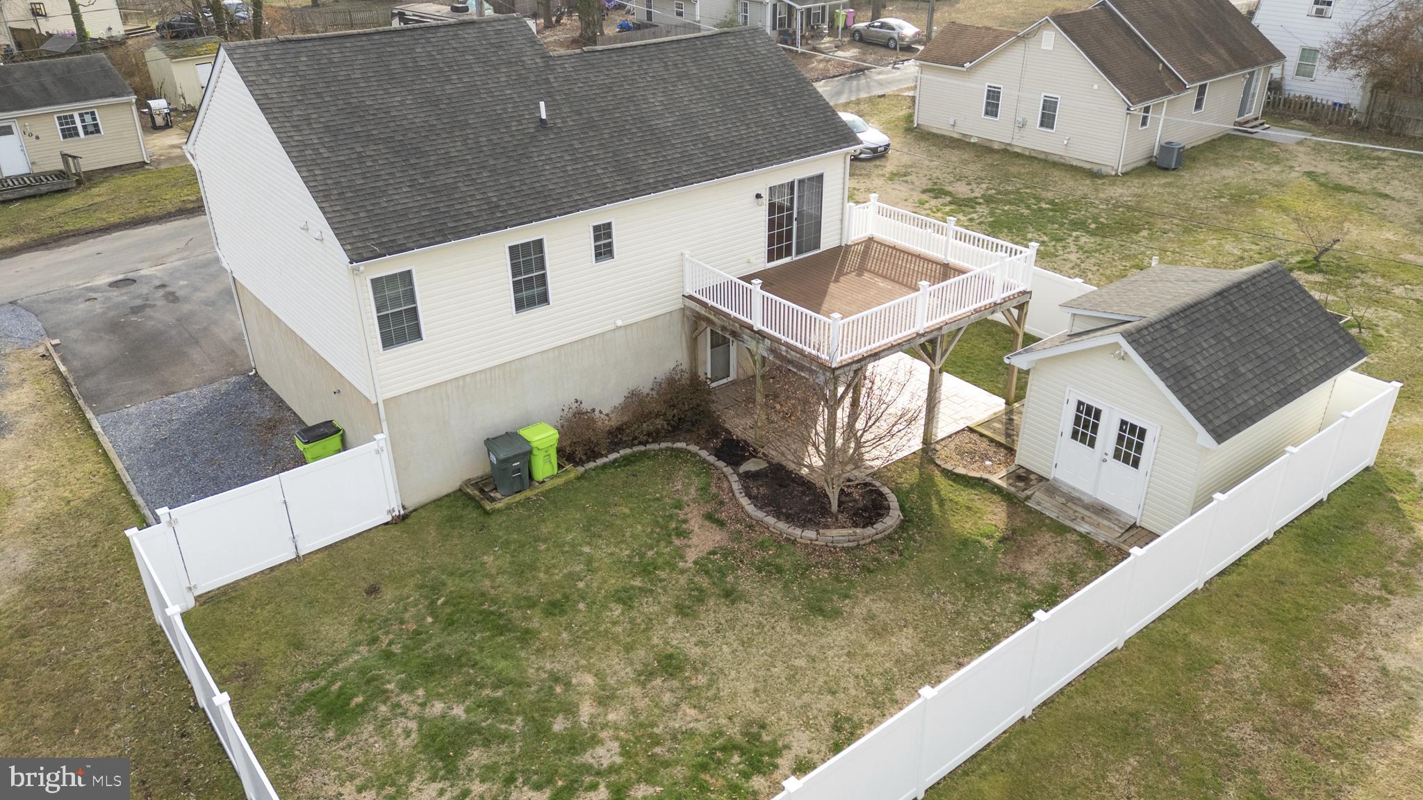 109 Price Road Chester, MD 21619 - Photo 2 of 32 nice backyard with deck, patio, fence and workshop