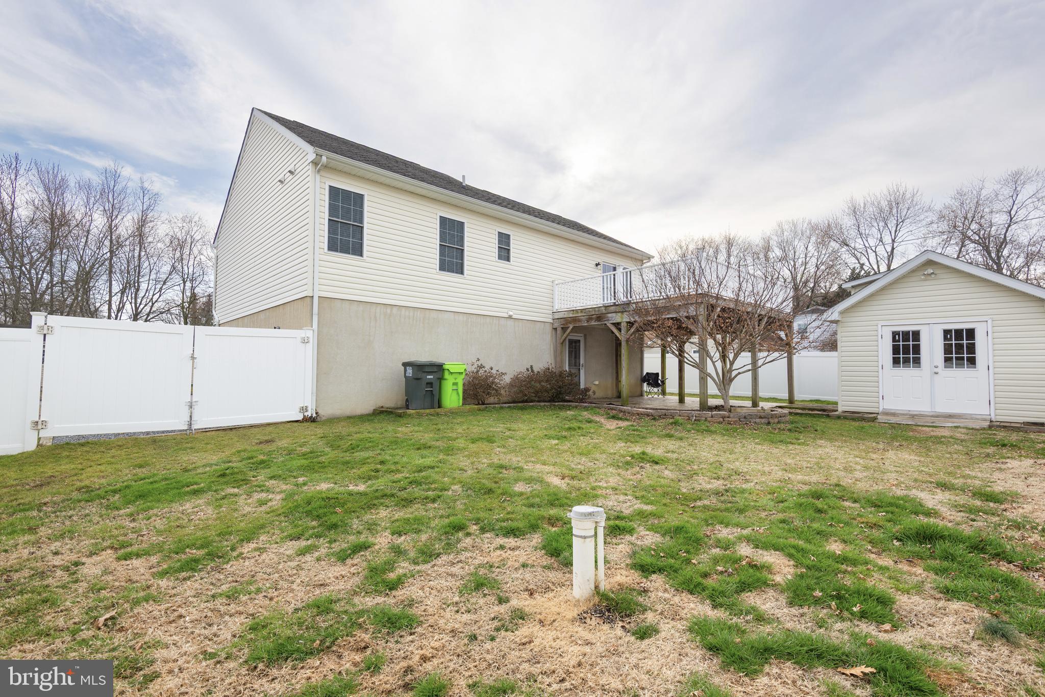 109 Price Road Chester, MD 21619 - Photo 30 of 32 backyard with deck and shed, vinyl fence