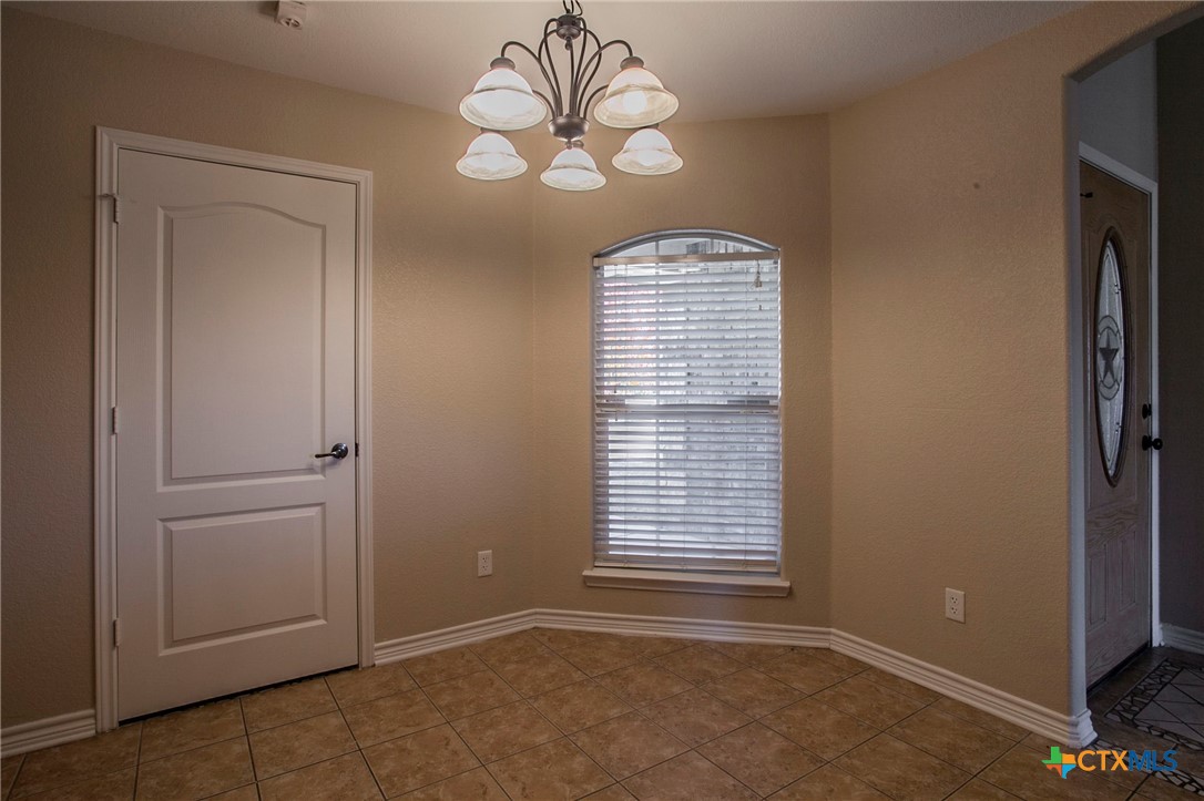 3710 Dewitt County Court Killeen, TX 76549 - Photo 5 of 18 an empty room with windows and fan