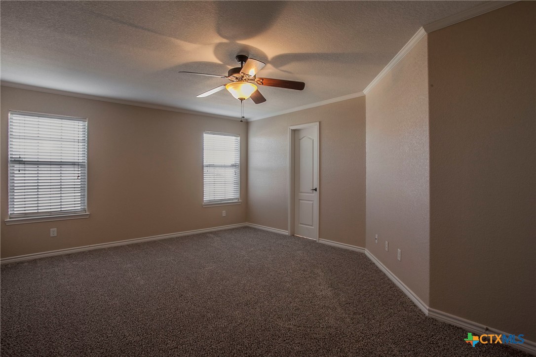 3710 Dewitt County Court Killeen, TX 76549 - Photo 6 of 18 an empty room with windows and fan