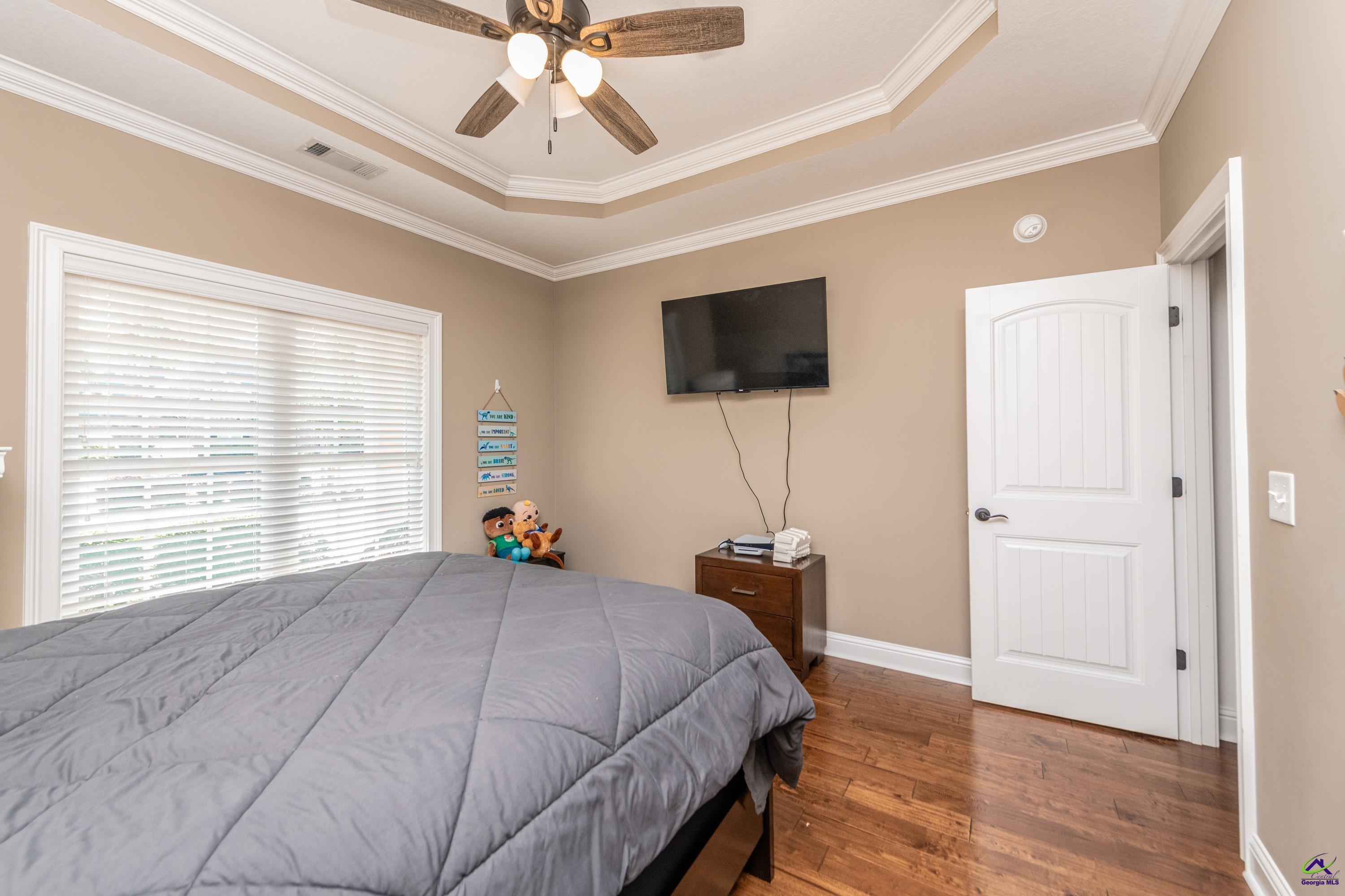 405 Old Bridge Road Warner Robins, GA 31088 - Photo 31 of 58 a bedroom with a bed and a flat screen tv